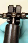 Seat the chain so it's against the strong part of the tool